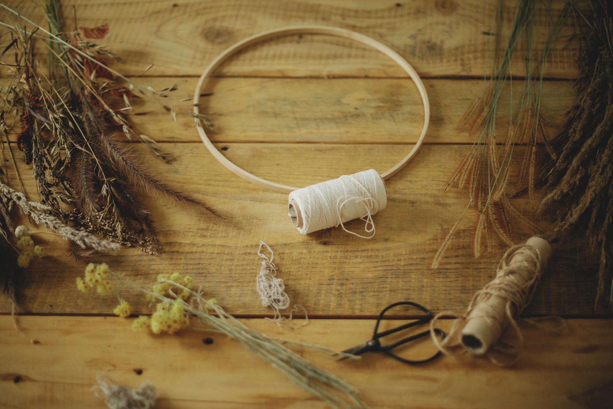 Workshop table with threads, hoops and sketches